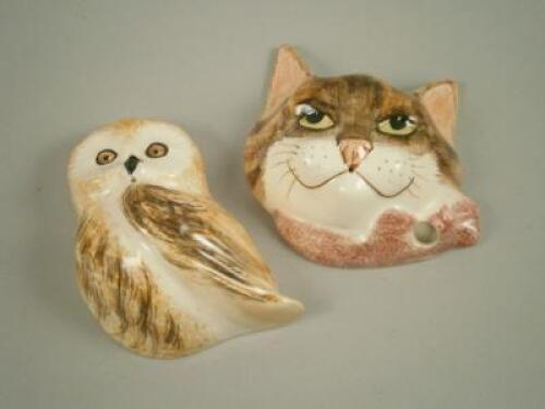 Two pottery wall plaques