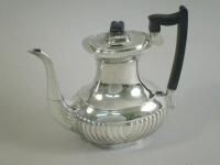 A silver coffee pot