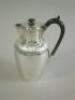 A Victorian silver hot water jug