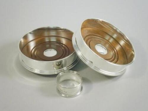 A pair of modern silver mounted and mahogany wine coasters