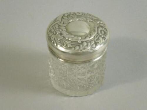 A cut glass and silver mounted dressing table jar