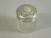 A cut glass and silver mounted dressing table jar