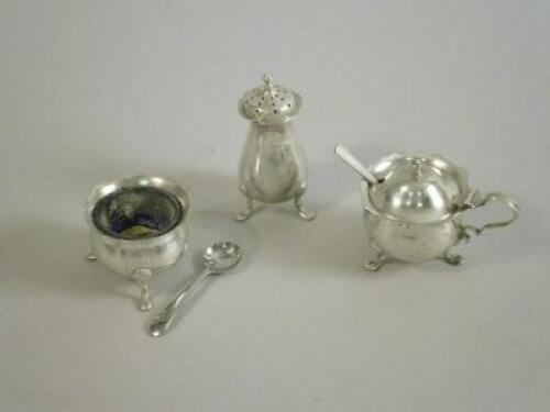 A silver four piece cruet