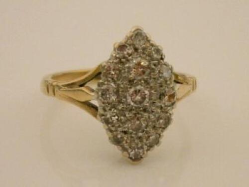 A plaque set diamond marquise shaped ring