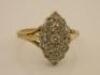 A plaque set diamond marquise shaped ring