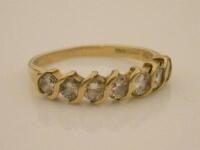 An 18ct gold half hoop diamond set ring