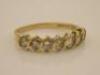 An 18ct gold half hoop diamond set ring