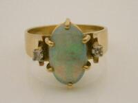 An opal and diamond set dress ring