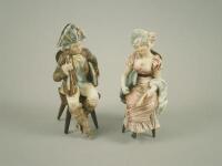 A pair of continental pottery figures