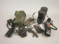 A miniature survival kit and a Mirage 200mm lens.