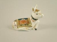 A Royal Crown Derby paperweight of a seated donkey