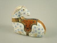 A Royal Crown Derby paperweight of a seated horse