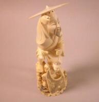 An oriental synthetic ivory figure of a fisherman