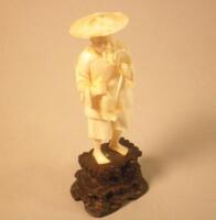 A Japanese carved ivory figure