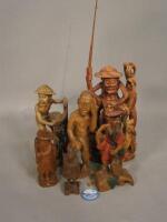 Assorted wooden carvings of fishing scenes