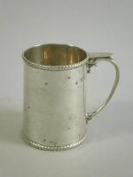 A silver christening mug