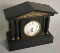 A French black slate and brass mantel clock