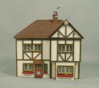 A modern mock Tudor dolls house with furniture