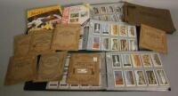 Four albums containing various cigarette cards