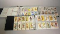 Three albums of various cigarette and tea cards