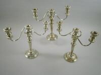 A set of three silver plated three branch candelabra