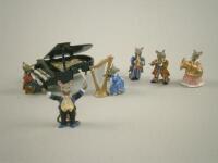 A set of miniature gold painted metal mouse musicians and a grand piano.