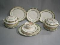 A Burleighware gilt and green banded dinner service.