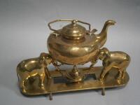 An Indian brass tea kettle