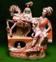 A Staffordshire figure of a man with a girl on a pony