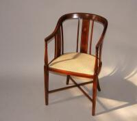 An Edwardian string inlaid mahogany bedroom chair.