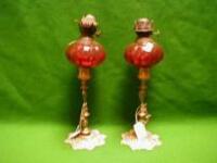 A pair of Victorian candlestick oil lamps
