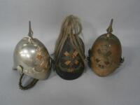 Three 1871 pattern helmets; being two marked for a Trooper of the Fife Light Horse