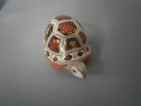 A Royal Crown Derby tortoise paperweight.