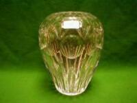 A heavy slice-cut crystal ovoid vase