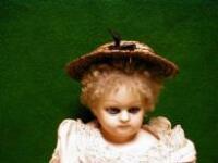 A celluloid doll with sleeping blue eyes