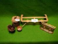 A dolls-house brass fender