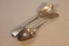 A pair of Victorian silver fiddle pattern table spoons