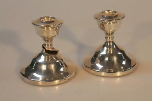 A pair of Elizabeth II silver dwarf candlesticks