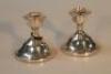 A pair of Elizabeth II silver dwarf candlesticks