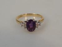 An 18ct gold amethyst and diamond set dress ring.