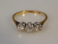 A three stone diamond dress ring