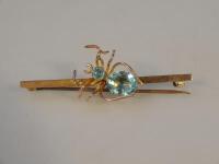 A spider topped bar brooch