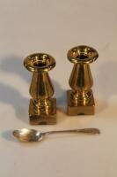 A pair of small brass candlesticks