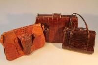 Three crocodile skin handbags.