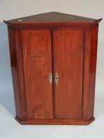 A late 18thC mahogany corner cupboard