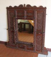 A large oak 19thC medieval style over mantel mirror