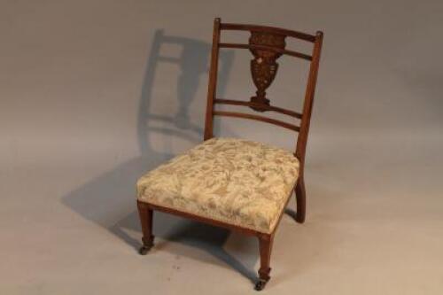 A late 19thC rosewood inlaid nursing chair