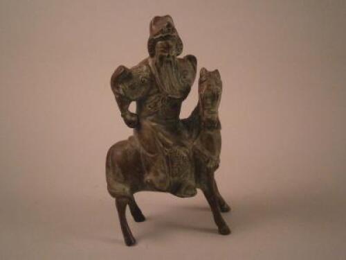 A modern Chinese bronze figure of a warrior on horseback