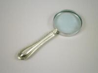 A silver mounted magnifying glass