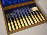 A set of silver plated fish knives and forks